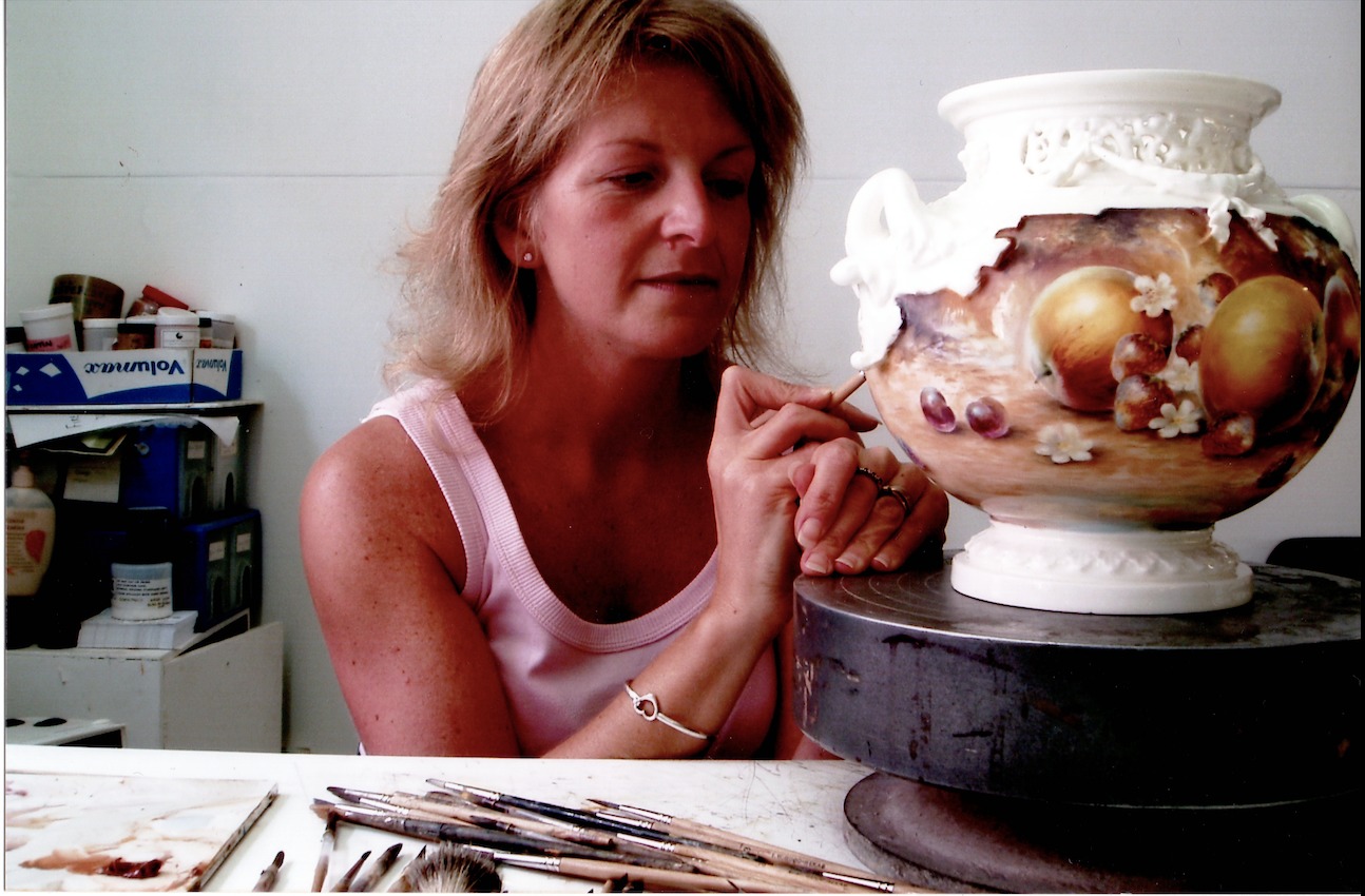 Sally Wood painting a Royal Worcester vase